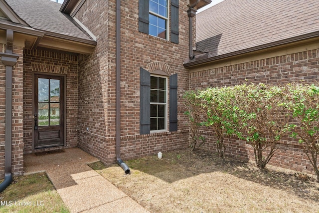 4913 Deer Run Rd, Olive Branch, MS 38654 - property entrance with a shingled roof and brick siding