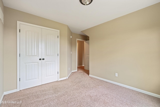 4913 Deer Run Rd, Olive Branch, MS 38654 - unfurnished bedroom with carpet flooring, a closet, and baseboards