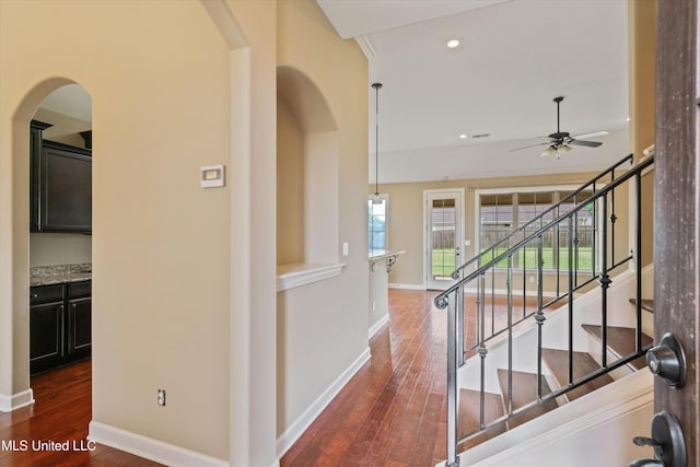 4913 Deer Run Rd, Olive Branch, MS 38654 - hall featuring wood finished floors, baseboards, arched walkways, and recessed lighting