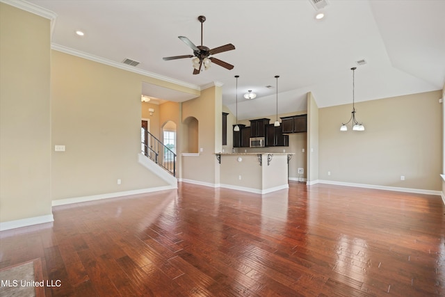 4913 Deer Run Rd, Olive Branch, MS 38654 - unfurnished living room with ceiling fan, hardwood / wood-style flooring, arched walkways, crown molding, and baseboards