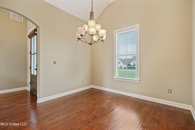 4913 Deer Run Rd, Olive Branch, MS 38654 - spare room with arched walkways, a chandelier, dark wood-style floors, baseboards, and vaulted ceiling