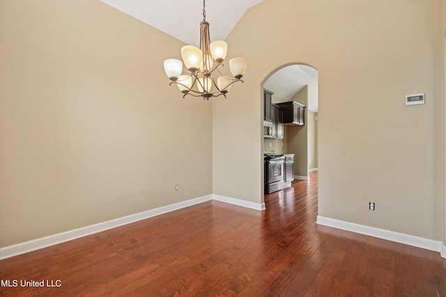 4913 Deer Run Rd, Olive Branch, MS 38654 - spare room featuring arched walkways, a chandelier, dark wood-type flooring, lofted ceiling, and baseboards