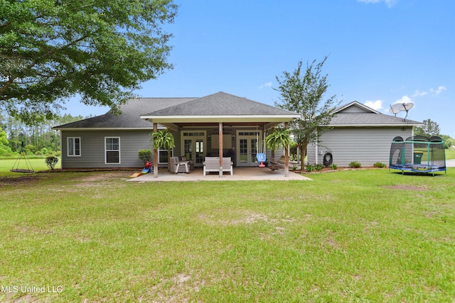 8100 Belle Etheridge Rd, Lucedale, MS 39452 - rear view of property with a trampoline, french doors, a patio, a yard, and roof with shingles