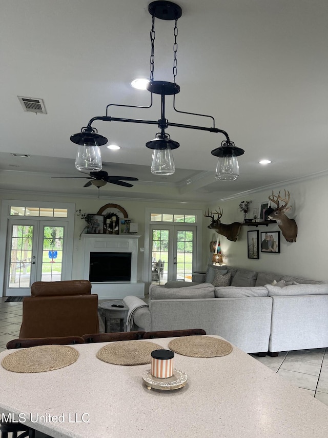 8100 Belle Etheridge Rd, Lucedale, MS 39452 - dining area featuring french doors, crown molding, light tile patterned floors, and ceiling fan