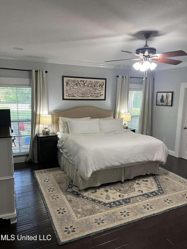 8100 Belle Etheridge Rd, Lucedale, MS 39452 - bedroom with dark wood finished floors, ornamental molding, a ceiling fan, and baseboards