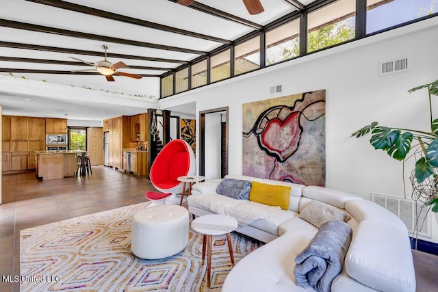 426 Donwood Pl, Biloxi, MS 39530 - living room featuring a ceiling fan, a high ceiling, and tile patterned floors