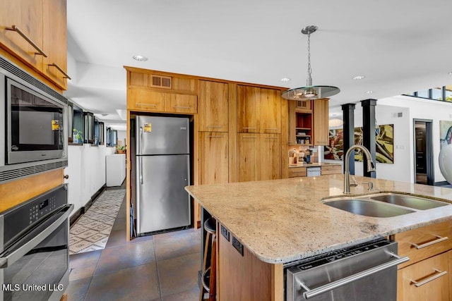 426 Donwood Pl, Biloxi, MS 39530 - kitchen featuring stainless steel appliances, a sink, recessed lighting, light stone countertops, and hanging light fixtures