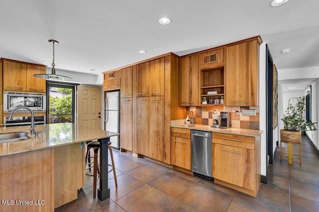 426 Donwood Pl, Biloxi, MS 39530 - kitchen with a sink, appliances with stainless steel finishes, tasteful backsplash, recessed lighting, and light stone countertops