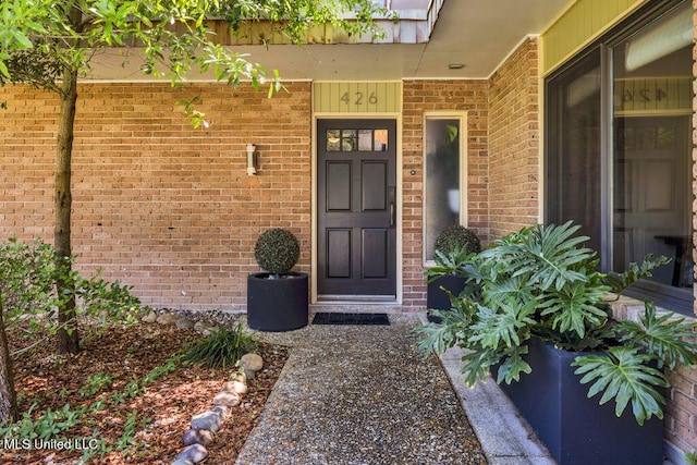 426 Donwood Pl, Biloxi, MS 39530 - view of exterior entry featuring brick siding