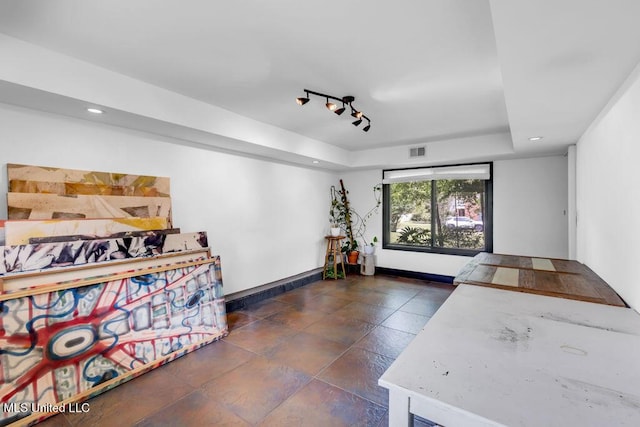 426 Donwood Pl, Biloxi, MS 39530 - bedroom with a tray ceiling, baseboards, recessed lighting, and rail lighting