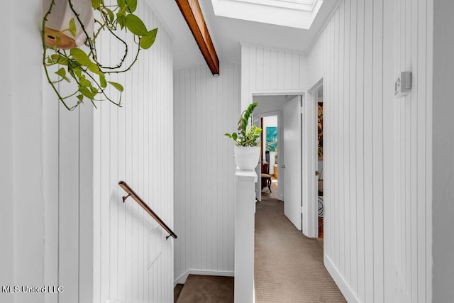 426 Donwood Pl, Biloxi, MS 39530 - hall featuring a skylight, an upstairs landing, beam ceiling, and carpet floors