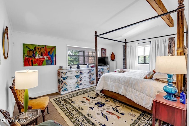 426 Donwood Pl, Biloxi, MS 39530 - bedroom with lofted ceiling, multiple windows, baseboards, and wood finished floors