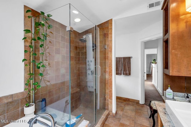 426 Donwood Pl, Biloxi, MS 39530 - full bathroom featuring a sink, a shower stall, recessed lighting, baseboards, and stone finish flooring