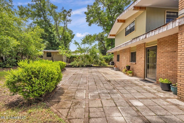 426 Donwood Pl, Biloxi, MS 39530 - view of patio with an outbuilding and a storage shed