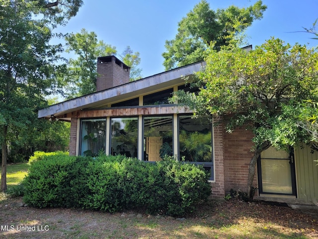 426 Donwood Pl, Biloxi, MS 39530 - rear view of property featuring a chimney and brick siding