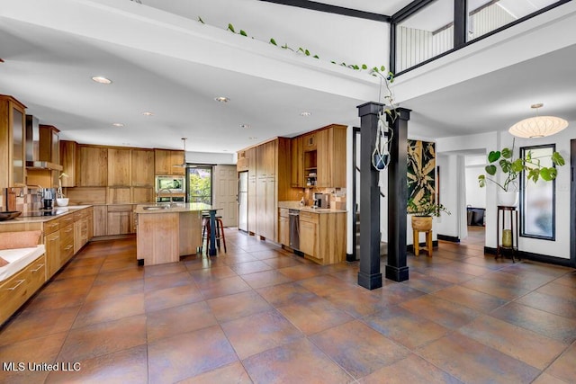 426 Donwood Pl, Biloxi, MS 39530 - kitchen with appliances with stainless steel finishes, light countertops, a breakfast bar, recessed lighting, and a kitchen island