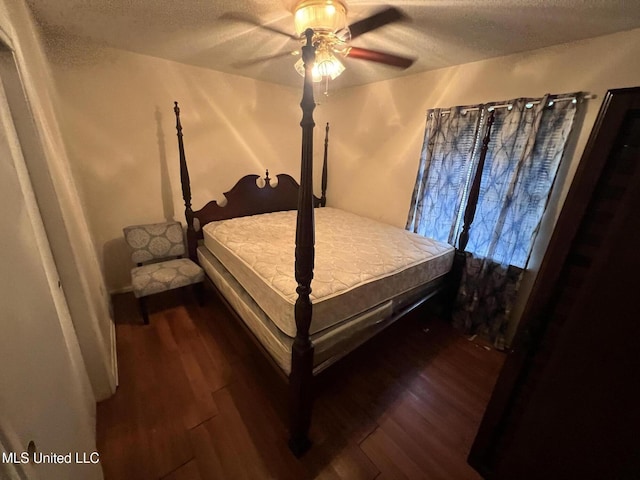 3718 Anita St, Gulfport, MS 39501 - bedroom featuring wood finished floors, a textured ceiling, and a ceiling fan