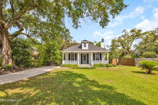bungalow featuring fence, roof with shingles, a front lawn, a porch, and a chimney