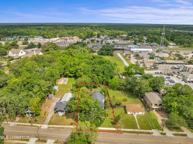 bird's eye view featuring a view of trees