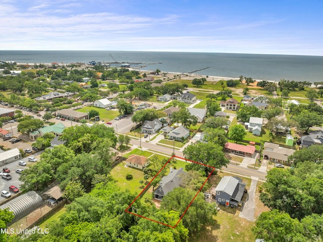 drone / aerial view with a water view and a residential view