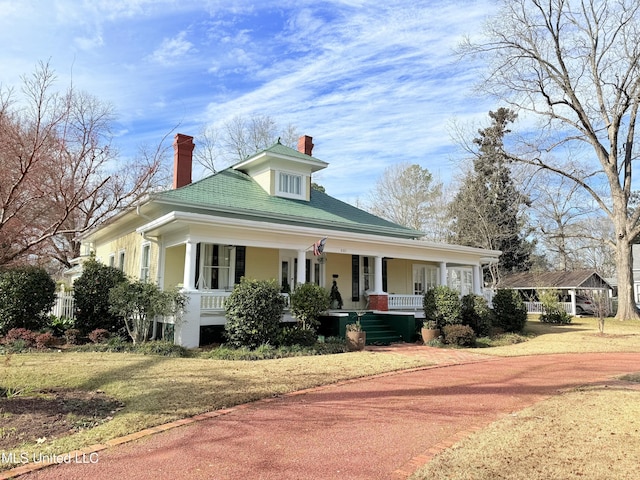 521 Holland Ave, Philadelphia, MS 39350 - country-style home with covered porch and a front yard