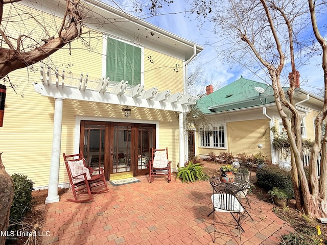 521 Holland Ave, Philadelphia, MS 39350 - rear view of property with a pergola, a patio, and french doors