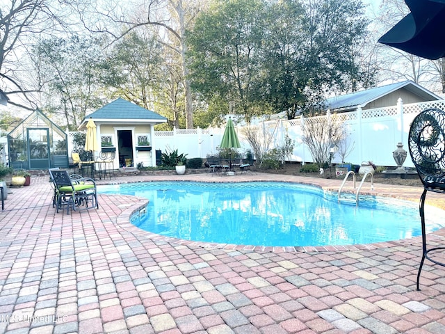 521 Holland Ave, Philadelphia, MS 39350 - view of swimming pool with a patio area and an outbuilding