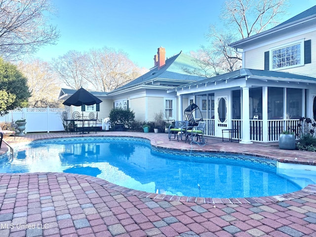 521 Holland Ave, Philadelphia, MS 39350 - view of pool featuring a sunroom and a patio