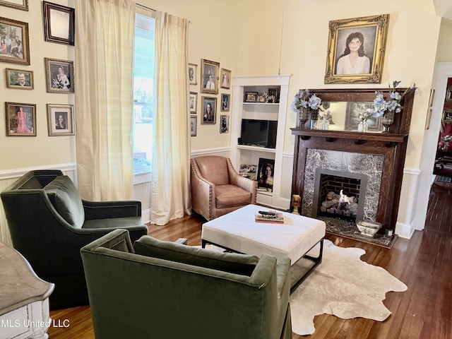 521 Holland Ave, Philadelphia, MS 39350 - sitting room with built in shelves, a premium fireplace, and dark wood-type flooring