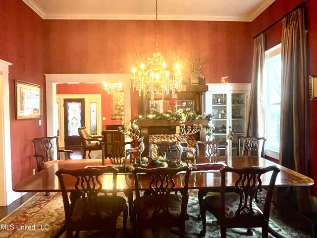 521 Holland Ave, Philadelphia, MS 39350 - dining room featuring plenty of natural light, ornamental molding, and an inviting chandelier