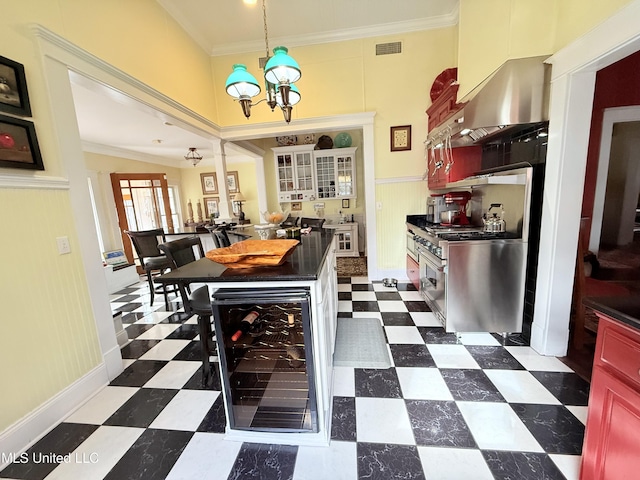 521 Holland Ave, Philadelphia, MS 39350 - dining room featuring a chandelier, beverage cooler, and ornamental molding