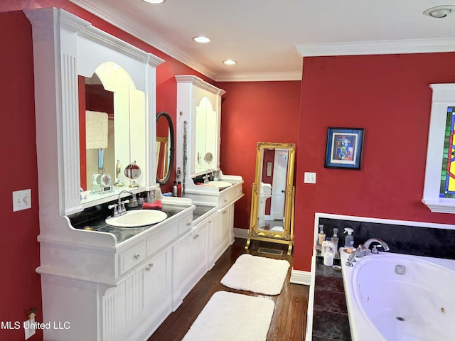 521 Holland Ave, Philadelphia, MS 39350 - bathroom with vanity, wood-type flooring, ornamental molding, and tiled tub
