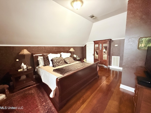 521 Holland Ave, Philadelphia, MS 39350 - bedroom featuring dark hardwood / wood-style flooring and vaulted ceiling