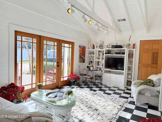 521 Holland Ave, Philadelphia, MS 39350 - living room with french doors, vaulted ceiling with beams, and rail lighting