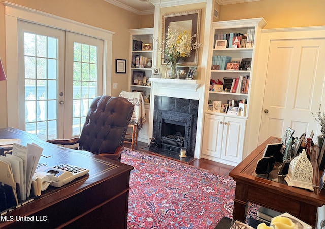521 Holland Ave, Philadelphia, MS 39350 - office space featuring dark hardwood / wood-style floors, a tiled fireplace, crown molding, and french doors