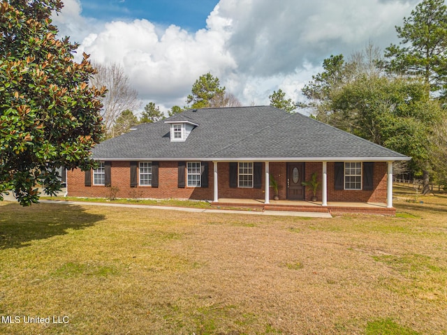 view of front of property with a porch and a front lawn