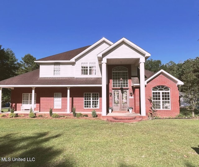 17500 Goff Farm Rd, Moss Point, MS 39562 - view of front of home featuring brick siding, a front yard, and a porch