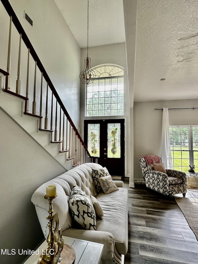 17500 Goff Farm Rd, Moss Point, MS 39562 - foyer entrance featuring a chandelier, wood finished floors, stairway, and a textured ceiling