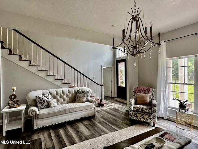 17500 Goff Farm Rd, Moss Point, MS 39562 - living area featuring a chandelier, stairs, wood finished floors, and a textured ceiling