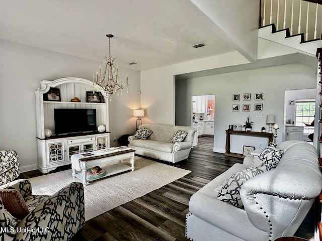 17500 Goff Farm Rd, Moss Point, MS 39562 - living room with a chandelier, dark wood-style flooring, and baseboards