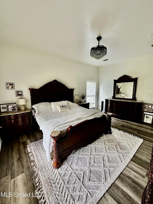17500 Goff Farm Rd, Moss Point, MS 39562 - bedroom featuring dark wood-type flooring