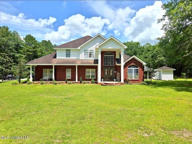 17500 Goff Farm Rd, Moss Point, MS 39562 - view of front of home with a front lawn, a porch, and roof with shingles