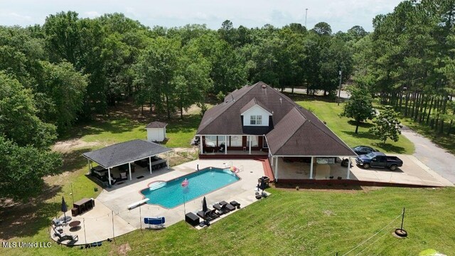 17500 Goff Farm Rd, Moss Point, MS 39562 - outdoor pool with a yard, a diving board, a gazebo, and a patio