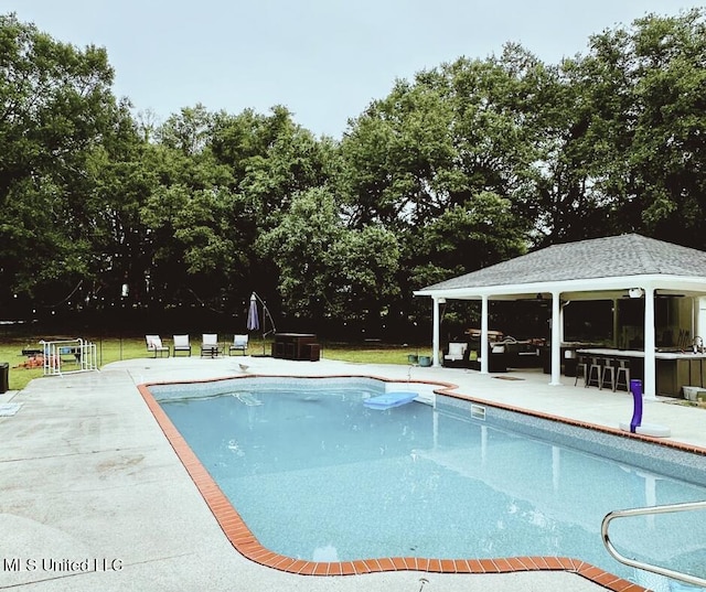17500 Goff Farm Rd, Moss Point, MS 39562 - outdoor pool with a patio, a gazebo, and view of scattered trees