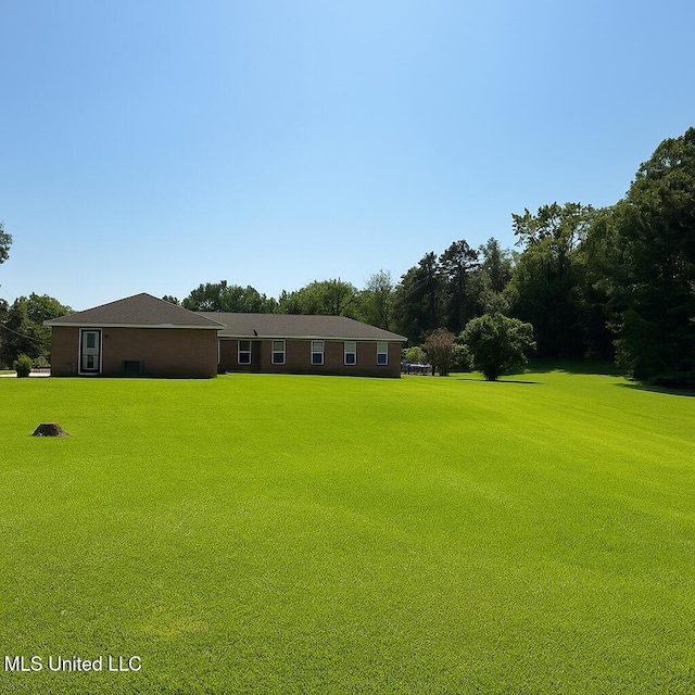 70 Yarbrough Loop, Holly Springs, MS 38635 - view of green lawn with view of scattered trees