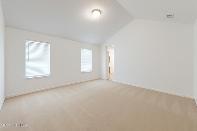 70 Yarbrough Loop, Holly Springs, MS 38635 - unfurnished room with vaulted ceiling and light colored carpet