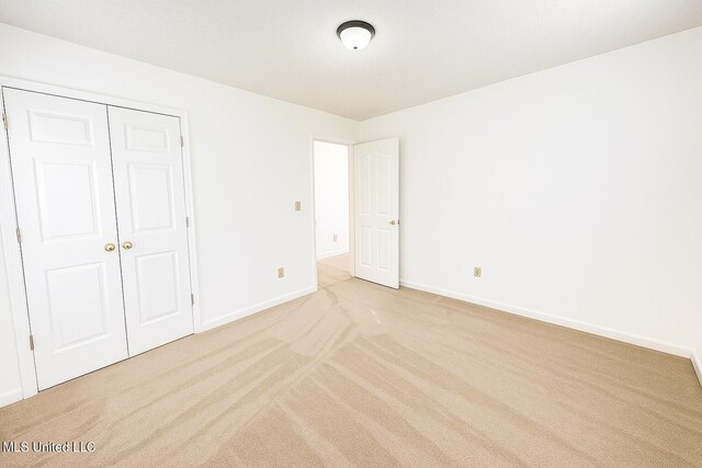 70 Yarbrough Loop, Holly Springs, MS 38635 - unfurnished bedroom with light carpet and a closet
