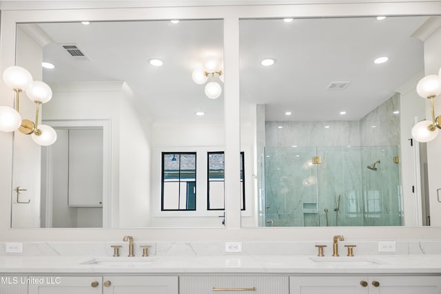 bathroom with vanity, ornamental molding, and walk in shower