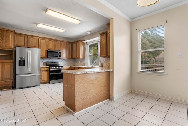 kitchen featuring ornamental molding, stainless steel appliances, light tile patterned floors, and backsplash