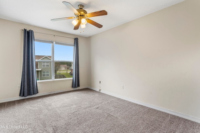 empty room featuring carpet flooring and ceiling fan